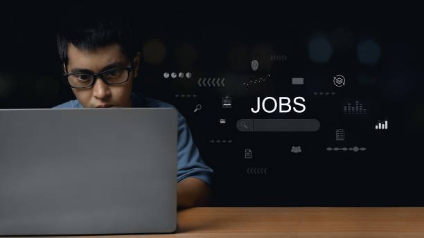 Young professional working from home with laptop, headphones, and coffee — representing entry-level remote jobs and digital nomad lifestyle