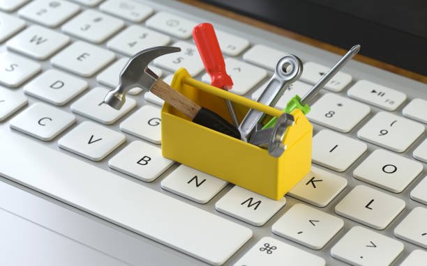 3D rendering of various tools placed on a laptop keyboard, symbolizing digital service and technical support concepts.