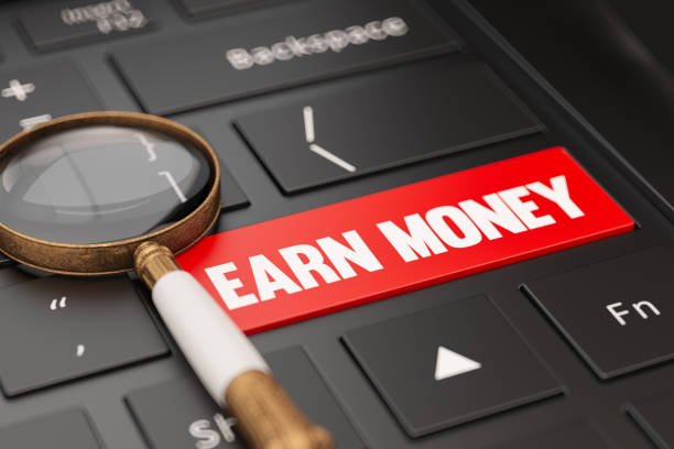 3D render of a computer keyboard with a magnifying glass highlighting the words "Earn Money Online," symbolizing digital income opportunities.