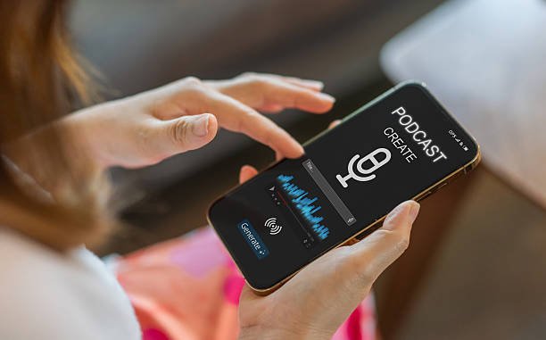 People creating a podcast on a smartphone using audio editing and AI tools for podcasters, recording voice content, and managing monetization.